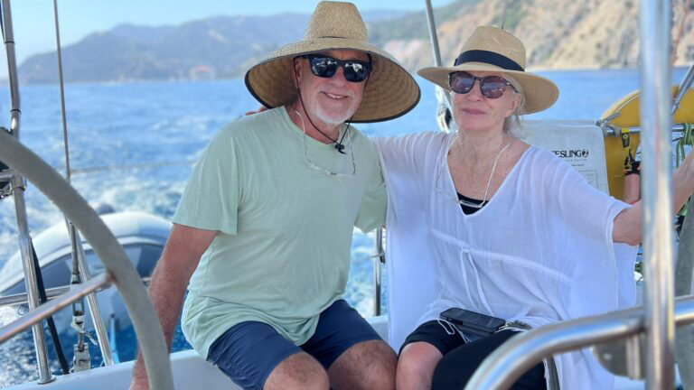 3-hr-cruise A Couple poses on the Cerulean Sea Charter during their 3hr cruise