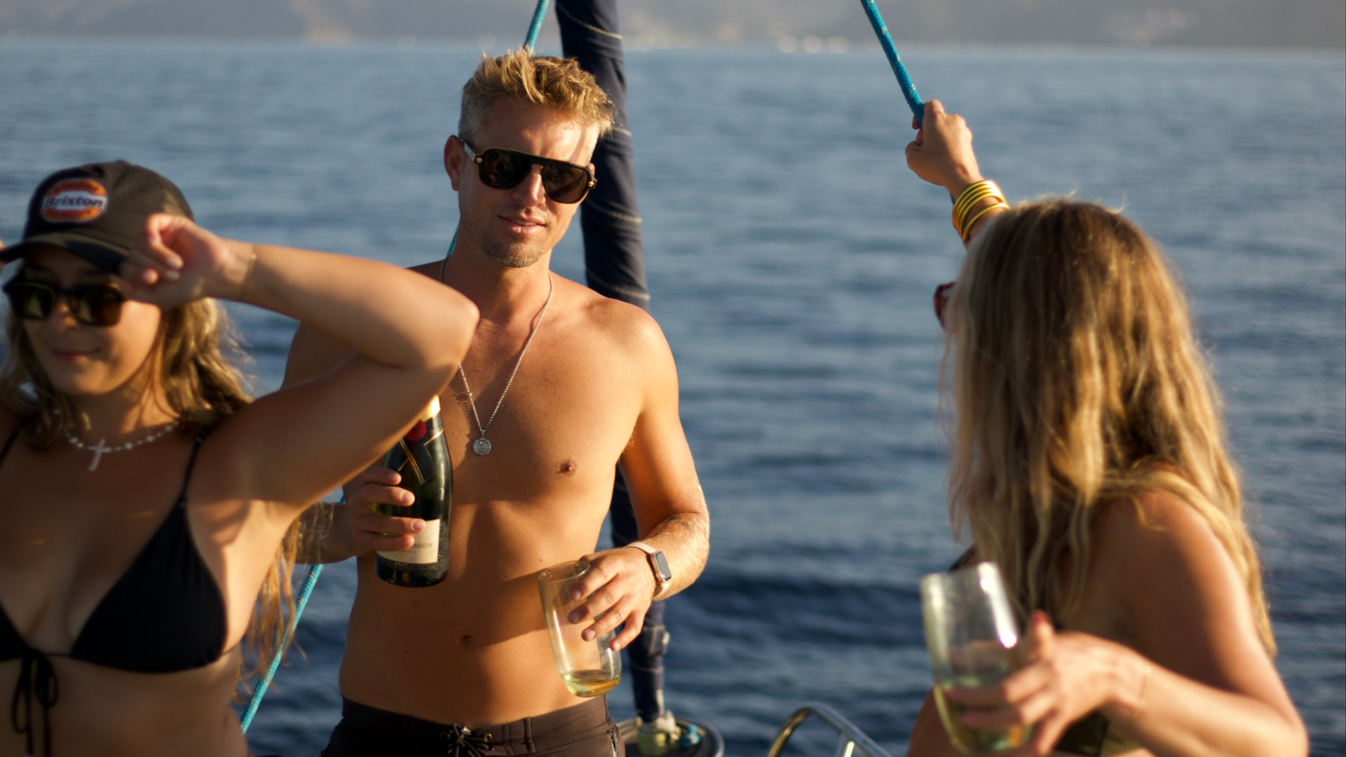 The-classic-sail Group of young adults enjoying a sunset and champagne aboard Cerulean